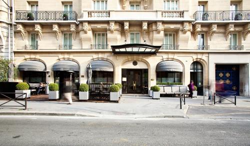 a large building with a large window on the side of the building at Hotel Montalembert in Paris