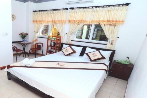 Giường trong phòng chung tại Lisa Homestay