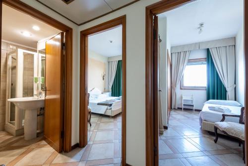 Ванная комната в Hotel Ristorante Maga Circe