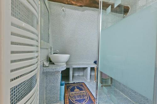 a bathroom with a sink and a toilet in it at Chambre Pasta - Moulin de Gâteau in Saint-Pierre-les-Étieux