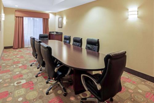 a conference room with a long table and chairs at La Quinta by Wyndham Stillwater -University Area in Stillwater