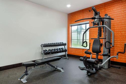 a fitness room with a gym with weights at La Quinta by Wyndham Houston Humble Atascocita in Humble
