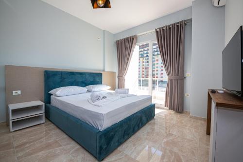 Postel nebo postele na pokoji v ubytování Ponari S Hotel
