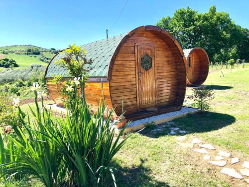 a small wooden hobbit house in a garden at Tenuta Morganti in Torano Nuovo