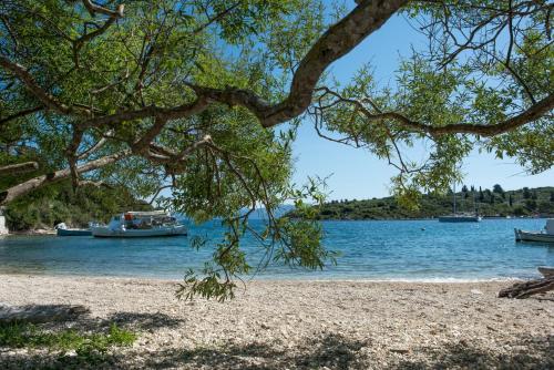 a view of a beach with boats in the water at Basilica Estate in Porto Ozias