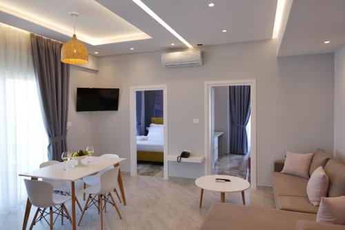 a living room with a couch and a table at Blue Water Hotel Ksamil in Ksamil