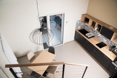 an overhead view of a kitchen with a table at Hotel Les Dunes in La Tranche-sur-Mer
