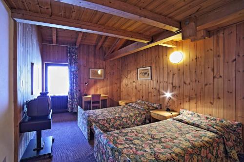 Кровать или кровати в номере Hotel Santa Caterina