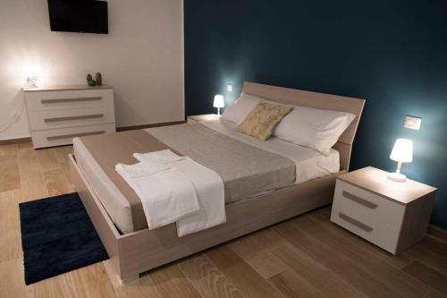 Posteľ alebo postele v izbe v ubytovaní Dante appsuite