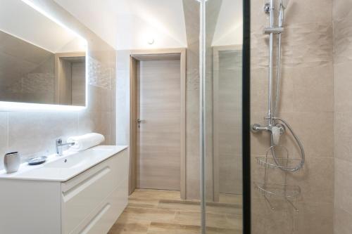 a bathroom with a shower and a sink at Niki in Labin