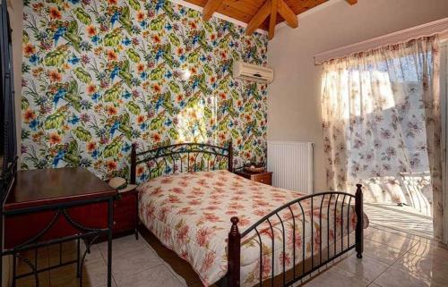 
a bedroom with a bed and a dresser at Tsiolis Studios & Apartments in Tsilivi
