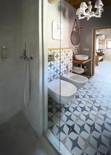 a bathroom with two toilets and a glass shower at Agriturismo Missanega in Monterosso al Mare
