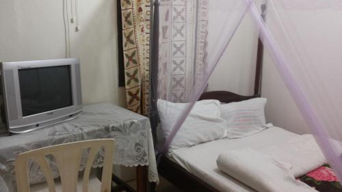 Ένα ή περισσότερα κρεβάτια σε δωμάτιο στο Hotel Delambiance