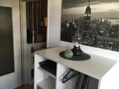 a room with a table with a view of a city at Mini-Ferien-Suite Hildesheim in Hildesheim