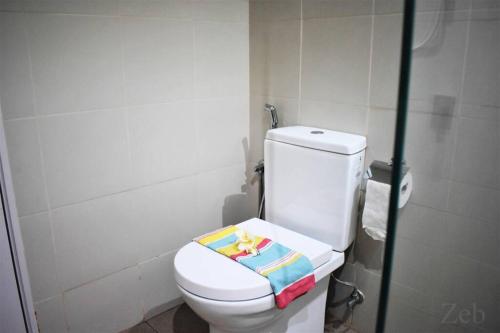 a bathroom with a toilet with a toy on the seat at i-City-Casa Joy - Wifi, Netflix - Movies, Parking, Sleeps 7 Pax in Kampong Padang Jawa