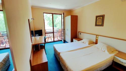 Postel nebo postele na pokoji v ubytování Hotel Villa Bora