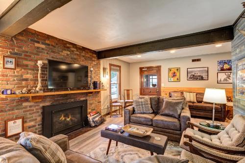 a living room filled with furniture and a fire place at Fireside Inn in Breckenridge