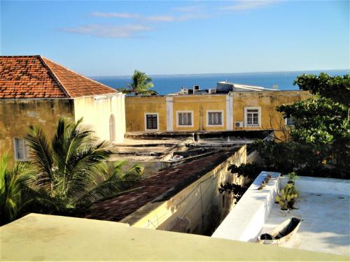 a view of a building from a balcony at Jardim dos Aloés, Unique B&B - Casa de Charme in Ilha de Moçambique