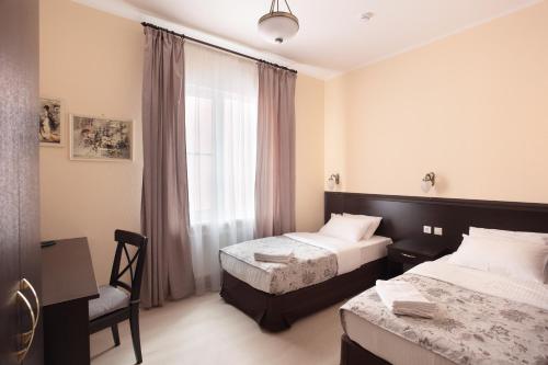 
Кровать или кровати в номере Петровский двор 
