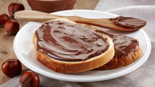 a chocolate covered piece of bread on a plate at Empire Suite Hotel in Istanbul