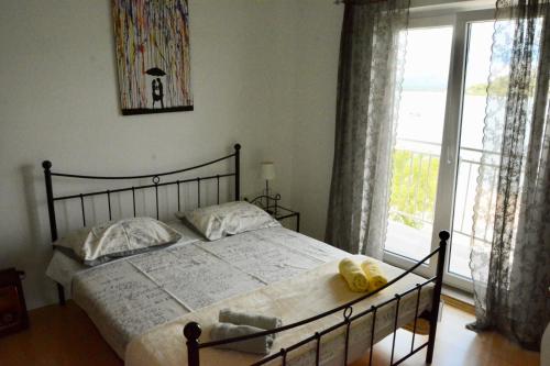 Ένα ή περισσότερα κρεβάτια σε δωμάτιο στο apartman Klara