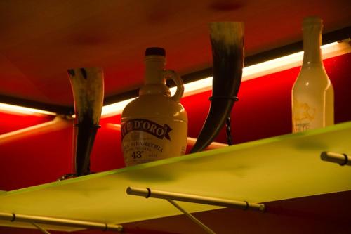 three bottles of wine are sitting in a refrigerator at Hotel Munde in Telfs