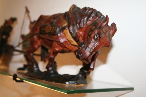 a figurine of a horse on a glass table at Hotel Munde in Telfs