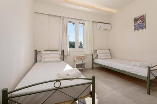 เตียงในห้องที่ Michaelo Villa - Affordable Luxury!