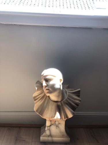 a statue of a woman sitting on the floor at Lighthouse apartment in Corfu Town