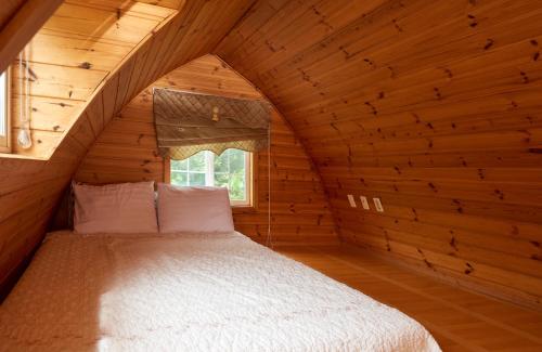 Postel nebo postele na pokoji v ubytování CHAEUL Pension