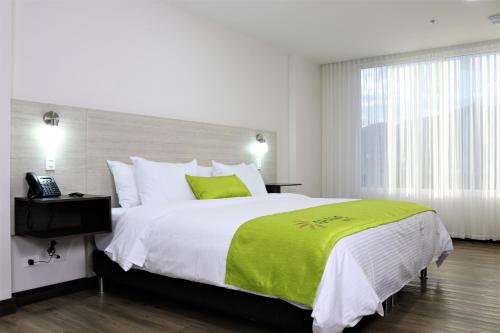 Arame Hotel tesisinde bir odada yatak veya yataklar