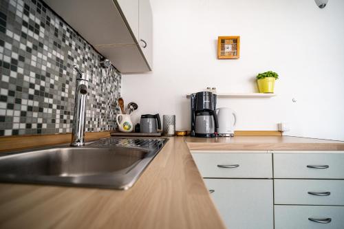 Η κουζίνα ή μικρή κουζίνα στο Apartments A&T