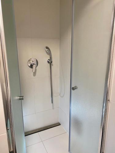 a shower with a shower head in a bathroom at P&P APARTMÁNY Bojnice in Bojnice