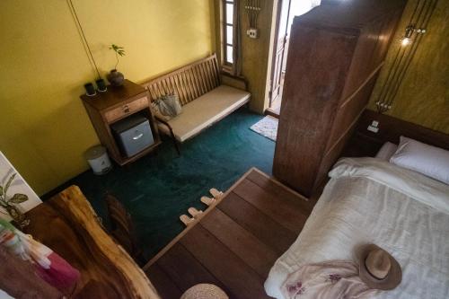 an overhead view of a room with a bed and a table at Leranda Homestay in Hue