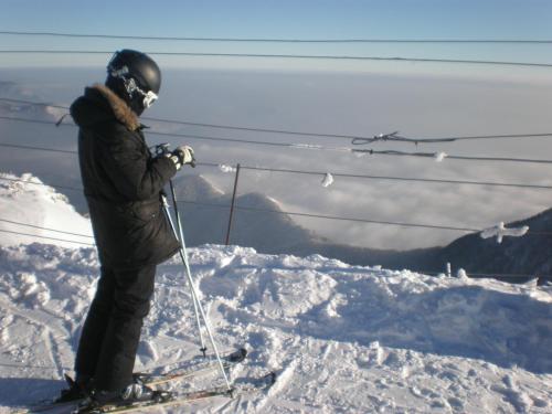a person on skis standing on top of a mountain at Hotel Krona Domžale in Domžale