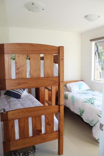 a bedroom with two bunk beds and a bed at Luxury Retreat with Swim Spa in Taupo