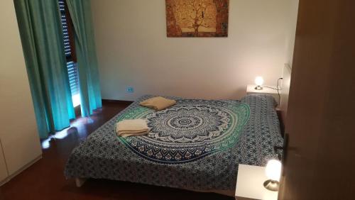 Postel nebo postele na pokoji v ubytování Home Holidays Pisa