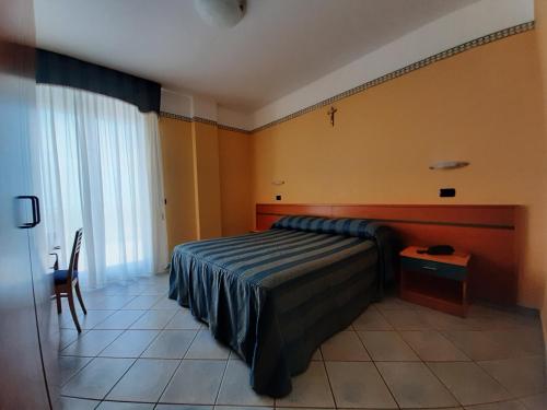 Кровать или кровати в номере Hotel Pegaso