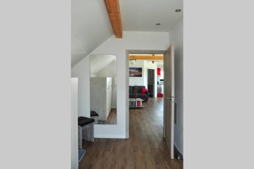 a view of a living room from the hallway at Ferienwohnung „Zum Leuchtturm“ in Großdubrau