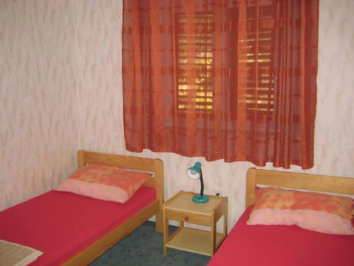 Postel nebo postele na pokoji v ubytování Marijan Martinović Apartments