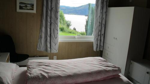 Ένα ή περισσότερα κρεβάτια σε δωμάτιο στο Skogstad Holiday Home
