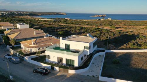an aerial view of a house with the ocean at Sunrise Villa in Sagres