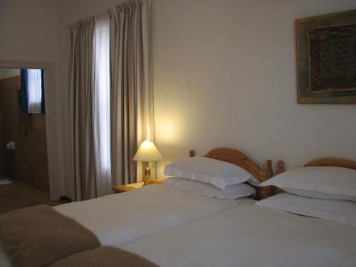 Llit o llits en una habitació de Toverberg Guest Houses