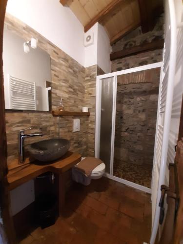 a bathroom with a sink and a shower at Antica Calvasino in Lezzeno