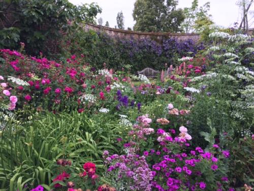 a garden filled with lots of colorful flowers at Sissinghurst Castle Farmhouse in Sissinghurst