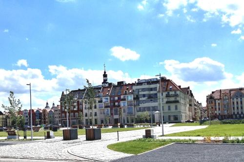 a large building on a street in a city at Apartament w Głogowie in Głogów