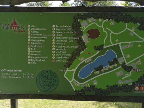 a sign with a map of a park at Ferienhaus HCR Grimmen in Grimmen