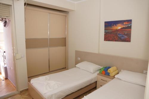 En eller flere senge i et værelse på DEA Apartment 1
