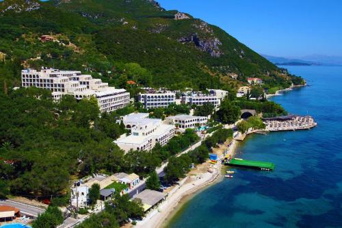 an aerial view of a town next to a body of water at Villa Angela, Traditional Villa in the village in Agios Ioannis Peristeron