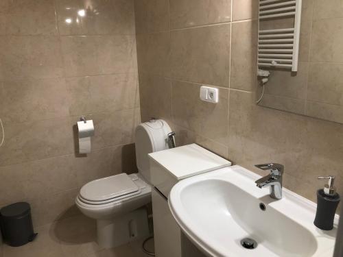 a bathroom with a sink and a toilet at Villa SCIROCCO Madeira - Ocean View in Machico